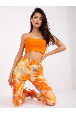 Pomarańczowe spodnie damskie we wzory